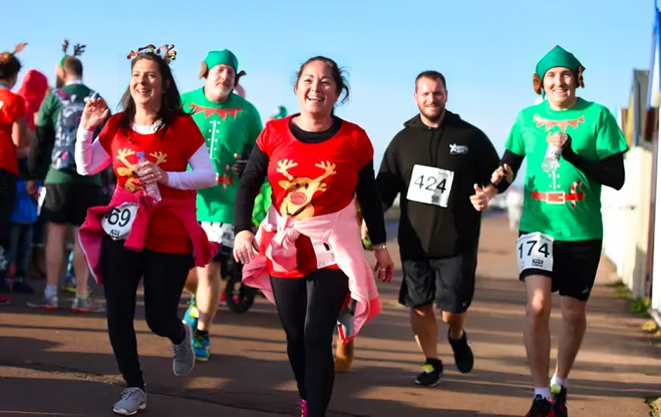 Runners participating in the Christmas Day Cracker Run along the Thames.