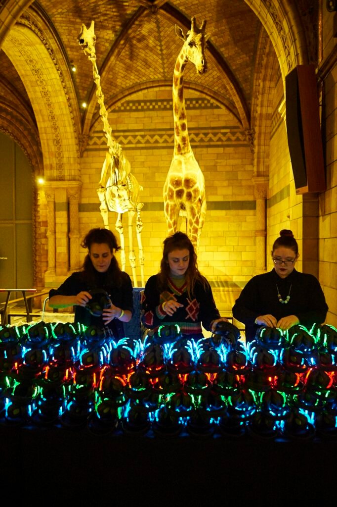 Three DJs performing at the Silent Disco party in London at the Natural History Museum.