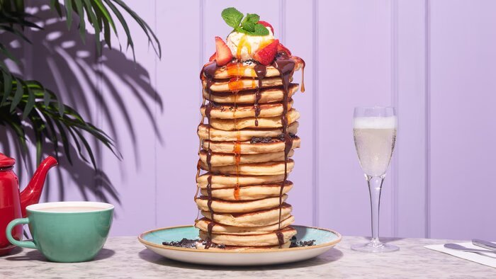 Delicious bottomless pancakes with Biscoff and fresh fruit toppings, served with syrup at Bill’s