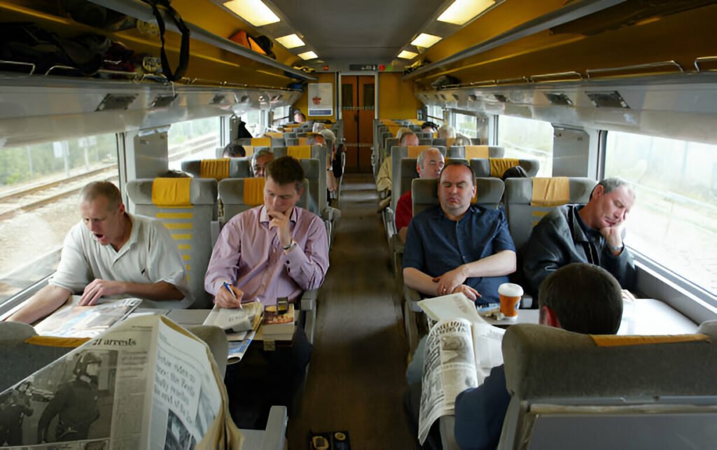 Passengers enjoying their journey inside the Eurostar train, traveling comfortably across Europe.