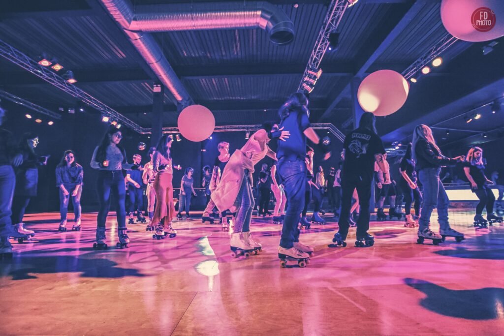 Roller skating at Rollernation in London with vibrant lights and energetic roller disco atmosphere