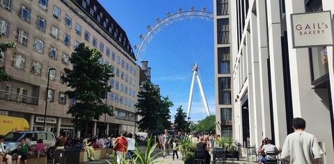 A freshly brewed cappuccino and pastries at GAIL’s Bakery, with the London Eye visible in the background