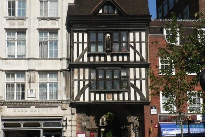 A medieval timber-framed gatehouse in London with Gothic detailing