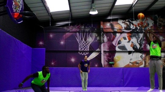 Jump higher and dunk bigger with trampoline-powered basketball. Trampoline basketball court with hoops at different heights